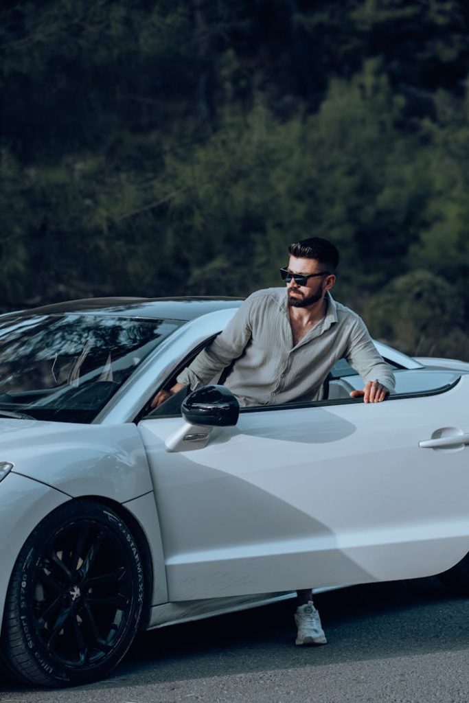 Man Entering White Luxury Car